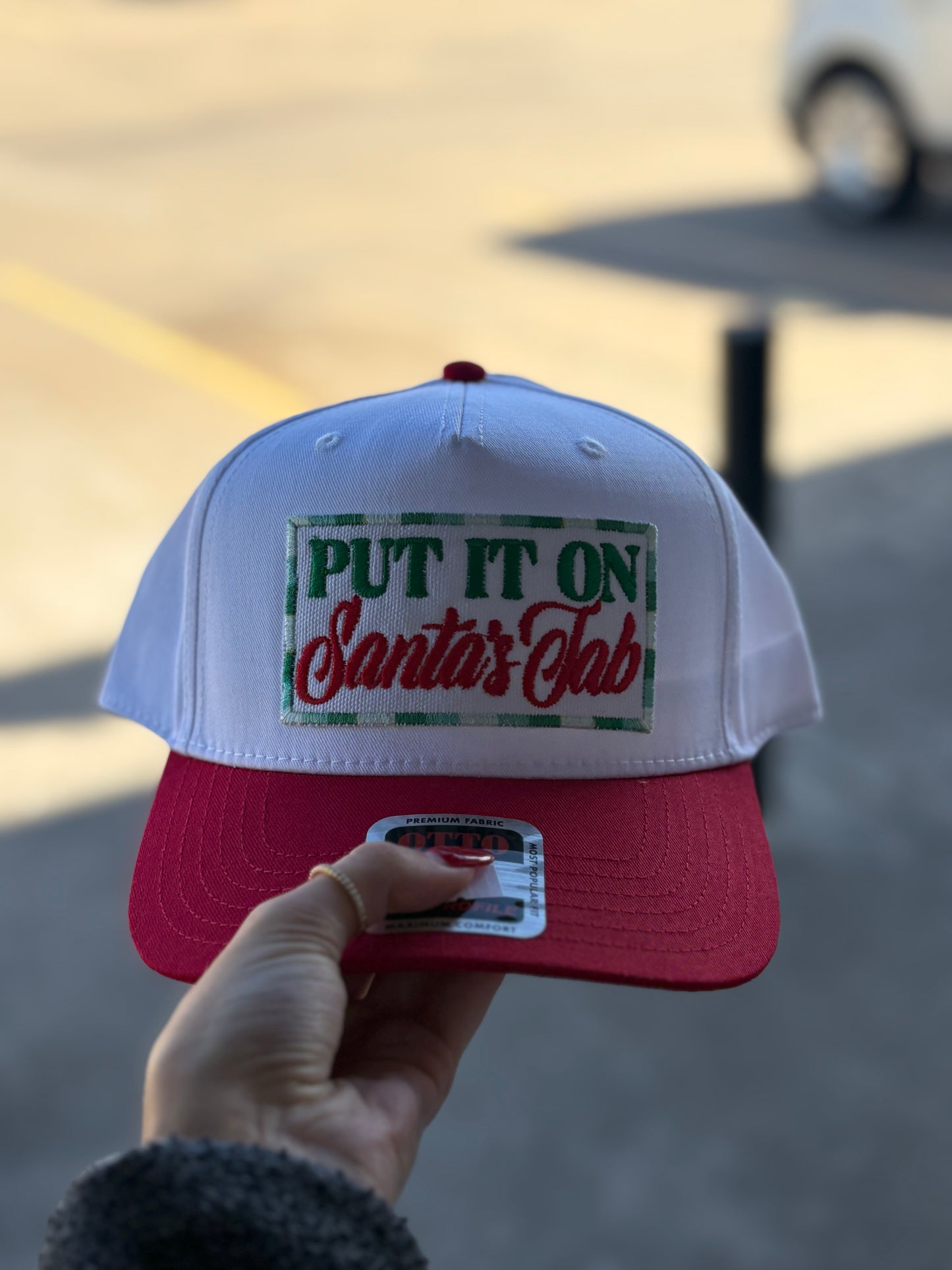 “PUT IT ON Santa’s Tab” Red & Green Hat